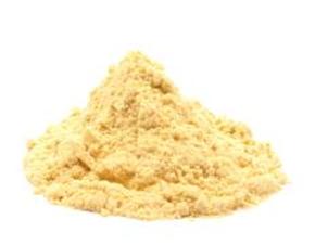 May include: A pile of light yellow powder, likely a spice or seasoning, against a white background. The powder has a fine, granular texture and forms a small mound. The color is a warm, inviting shade, suggesting a natural product. The image is well-lit, highlighting the texture and form of the powder.